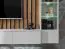 Mur de salon moderne avec panneau mural | Chêne artisan & gris | 4 portes, 8 compartiments | 148 x 220 x 35 cm