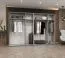 Armoire penderie Eiger 101 | 2 portes miroir | Fermeture douce | Chêne artisan | 4 tringles | 3 m large | Poignées coloris cachemire